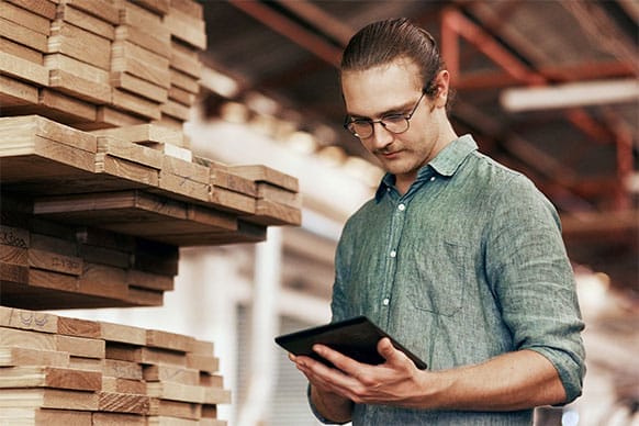 Akzonobel man with pad stand near wood